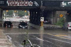 people-stuck-on-top-of-car-after-flooding-1-6965679-1721148856841